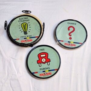 3 vintage Monopoly Cork coasters and metal holder